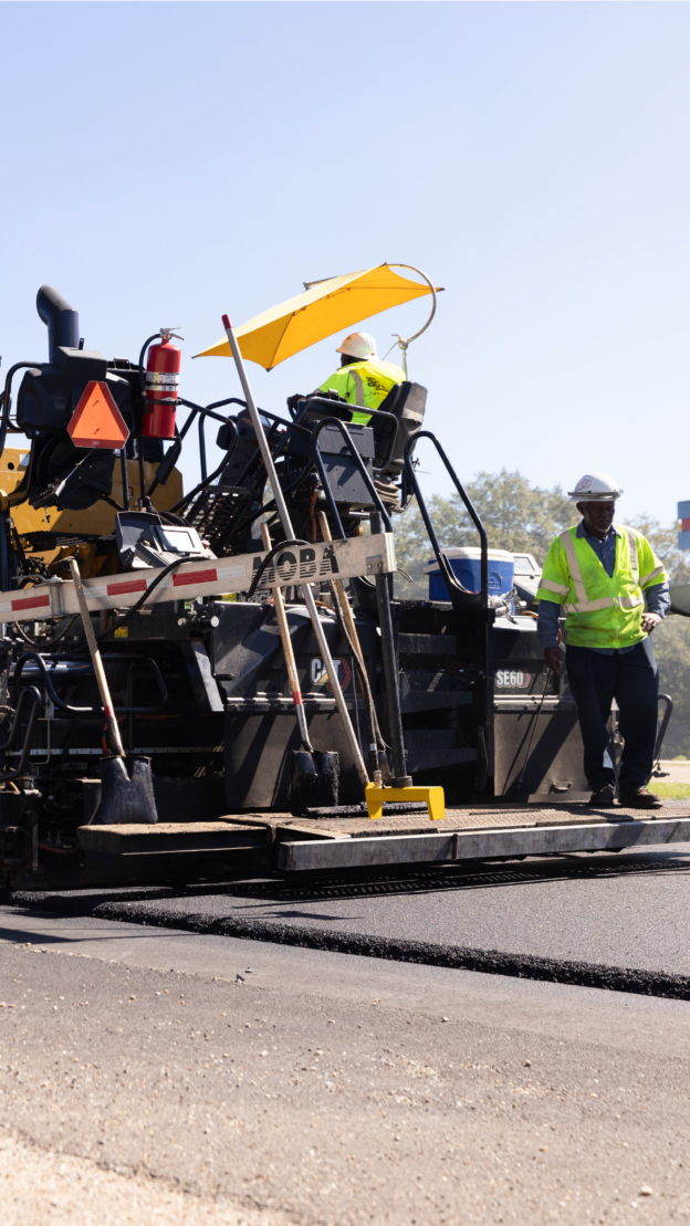 Operator running a paver/screed machine