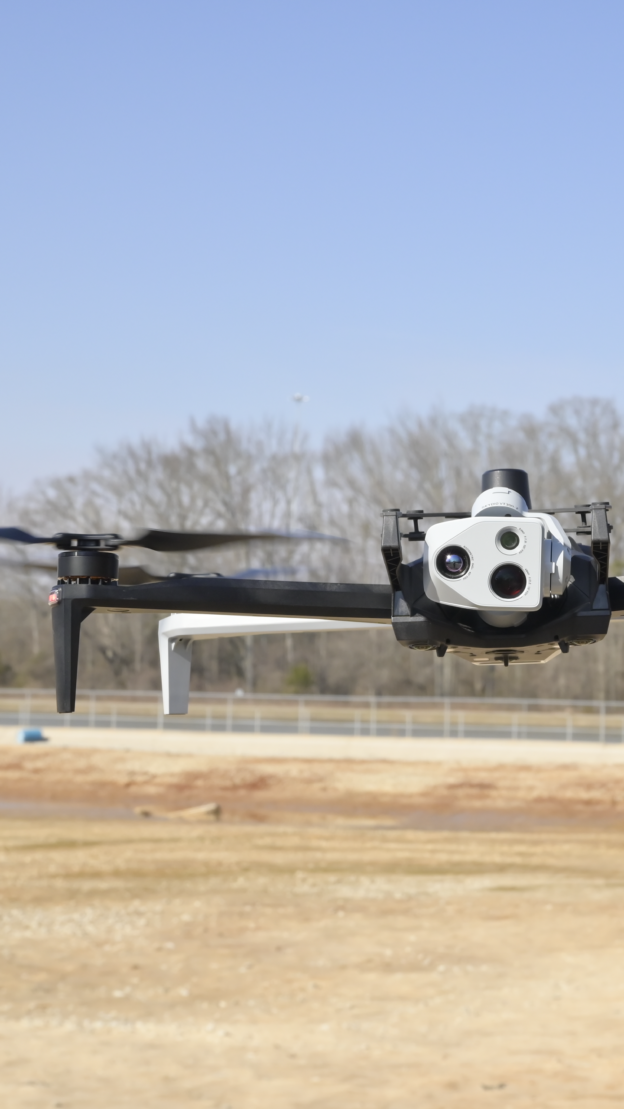 Drone flying in a field